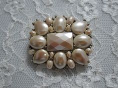 Liz Claiborne Assorted Ivory Pearls and Faceted Stones Brooch. This Brooch is so gorgeous!! Vintage Piece Marked LC.  Measurements: 1 1/4" X 1 5/8" "C" lock mechanism.  All items go through a detailed inspection and they are professionally cleaned prior to being released for sale and shipping. Once payment has cleared your item will be shipped immediately Organza Bag / Gift Box Included with Purchase Packed with extra care to avoid damages while shipping Elegant Cream Brooches For Formal Occasions, Vintage White Wedding Brooches, Vintage Monet, Ivory Pearl, Kissimmee, Pearl Grey, Fun Earrings, Strand Necklace, Organza Bags