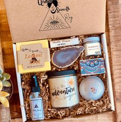 an open box containing soaps, candles and other items