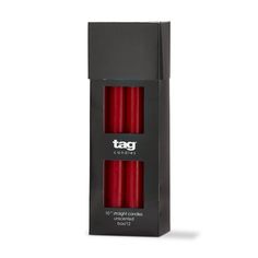 two red candles sitting in a black box on a white background with the tag logo