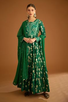 Bottle green tiered anarkali with dori, thread embroidery. Paired with trouser and striped dupatta. Components:3 Pattern:Embroidered Type of Work:Gota,Thread Neckline:Round Sleeve Type:Full Fabric:Viscose Gold Jacquard, Cotton Satin, Lurex Chiffon Color:Green Other Details: Floral pattern Length approx (in inch): Anarkali-57 Trouser-38 Occasion:Wedding - Aza Fashions Tiered Anarkali, Trouser Pattern, Embroidered Anarkali, Indian Suits, Thread Embroidery, Bottle Green, Set For Women, Anarkali, Aza Fashion