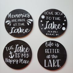 four black and white magnets with words on them that say, memories are made at the lake and life is better at the lake