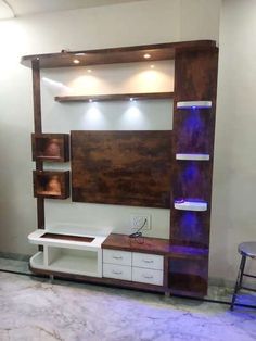 an entertainment center with shelving unit and lights