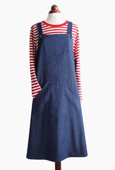 a mannequin wearing a denim dress with red and white stripes