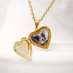 Celebrate the memory of your beloved canine companion with our custom heart locket necklace. This unique and personalized locket necklace with a photo insert allows you to carry a cherished picture of your dog close to your heart. It's a heartfelt gift for dog lovers and a touching keepsake for yourself. 💬 Please send us your image via direct messages. 📣 Additional information about the product 👉 Material: Stainless steel 👉 Finish: Silver, Gold, Rose Gold 🎁 Comes with a gift box Customizable Round Pendant Locket Necklace For Keepsake, Heart Shaped Locket Necklace For Best Friend, Customizable Keepsake Locket Necklace With Round Pendant, Keepsake Birthstone Pendant Locket Necklace, Keepsake Birthstone Locket Pendant Necklace, Classic Heart-shaped Keepsake Necklace, Heart-shaped Locket Necklace For Best Friend, Personalized Pendant Locket Necklace For Memorials, Gold Heart-shaped Charm Necklaces For Memorials