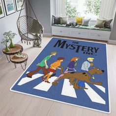 rug with cartoon characters walking across the street in front of a window, and an area rug that says'the mystery show '