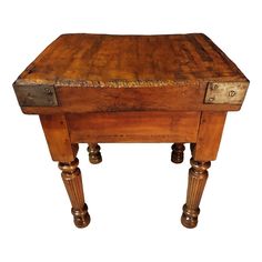 an old wooden table with two drawers on the top and one drawer at the bottom