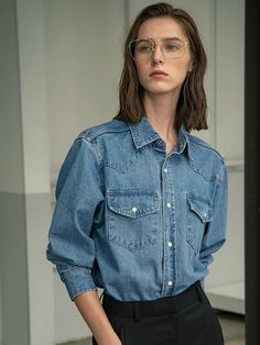 Editor's NotesA classic button down denim shirt with front pocket details and a regular fit silhouette. The signature Siyazu buttons adds a unique finishing touch to the calm and casual overall mood.- Soft to the touch material- Classic button down shirt- Double stitched ribbed edges on sleeves, hem and neck- Regular fit and silhouetteMeasurements(in.) Size S / M- Length: 27.56 in. / 27.95 in. - Shoulder: 18.11 in. / 18.50 in. - Chest: 22.44 in. / 23.23 in. - Sleeve length: 23.23 in. / 23.62 in.- Sleeve width: 9.25 in. / 9.65 in.  *Model info: Height 5' 64, Wearing a size S                   Composition & Care- 100% Cotton- Dry Clean Recommended Designer- by Siyazu Classic Denim Top With Pockets In Medium Wash, Blue Denim Shirt With Patch Pockets, Denim Button-up Tops With Pockets, Relaxed Fit Denim Top With Buttoned Pockets, Denim Blue Tops With Patch Pockets, Denim Tops With Patch Pockets For Work, Classic Light Wash Denim Top With Pockets, Classic Washed Blue Denim Top With Pockets, Classic Medium Wash Shirt For Work