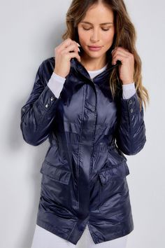 The stylish, sporty jacket that just happens to be wind-resistant, the Ramona is the one you'll want to pack for every trip. A longer-length style that weighs almost nothing and has lots of functional details like adjustable sleeve tabs and a removable hood (handy in unpredictable weather). It's the lightweight layer that everyone should have in their carry-on bag. Relaxed fit with adjustable cinched waist High collar Long sleeves with button cuffs and tabs for adjustable sleeve length Detachabl Shiny Sportswear, Sporty Jacket, Curvy Pants, Leather Outfits, Panel Leggings, Safari Jacket, Shiny Clothes, Leather Outfit, Spring Dress