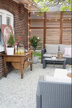 the patio is decorated with outdoor furniture and lights