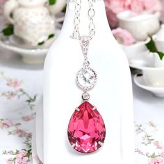 Elegant and romantic necklace made with: - gorgeous 18x13mm Rose teardrop pear shaped fancy stone, set in sterling silver plated setting - Hypoallergenic, Rhodium plated and tarnish resistant beautiful Cubic Zirconia embellished bail - sparkling .925 Sterling Silver connector with AAA Cubic Zirconia stone - the pendant drop is 1 1/2" long Finished with a sterling silver clasp and chain, the necklace is 16" and with a 2" extender chain the length can be adjusted to your choice.  MATCHING EARRINGS are available here: https://www.etsy.com/listing/224363580/pink-bridal-earring-fuchsia-earring https://www.etsy.com/listing/227859096/pink--crystal-earrings-bridal https://www.etsy.com/listing/231176642/pink-earrings-pink-bridesmaid-gift https://www.etsy.com/listing/227717919/pink-crystal-and-sterl Crystal Teardrop Pendant Necklace Gift, Elegant Pink Drop Necklace For Gift, Elegant Pink Pear-shaped Necklace, Elegant Pink Teardrop Pendant Drop Necklace, Pink Teardrop Pendant Drop Necklace Gift, Elegant Teardrop Necklaces For Valentine's Day, Elegant Teardrop Necklace For Valentine's Day, Elegant Pink Teardrop Drop Necklace, Pear-shaped Crystal Drop Necklace Gift