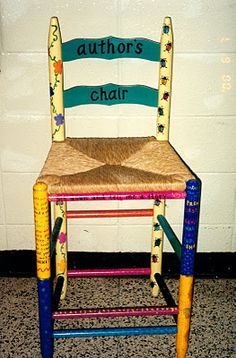 a child's wooden chair with writing on the back and seat made out of crayons