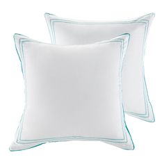 two white pillows with blue piping on them