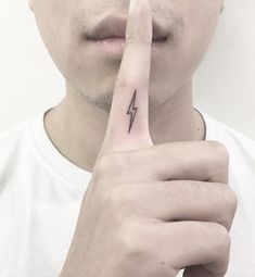 a man making a finger sign with his fingers