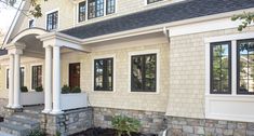 a house with stone steps leading up to the front door