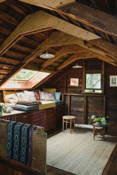 an attic with wood paneling and wooden furniture