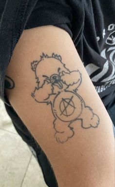 a person with a bear tattoo on their arm