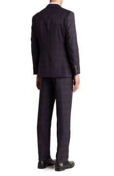 Make a dapper appearance at your next formal event in this clean-cut plaid suit that includes a peak lapel jacket and flat-front trousers. Jacket: 30.5" length (size 40R); trousers: 11" rise, 36" inseam (size 33W) Jacket has four-button cuffs; chest welt pocket; front flap pockets Trousers have zip fly closure; front pockets; back pockets Shell: 79% polyester, 20% rayon, 1% spandex Lining: 100% polyester Dry clean Imported Model stats: 6'1" height, 32" waist. Model is wearing size (size 33W). Plaid Notch Lapel Suit For Business Casual, Plaid Suits For Semi-formal Occasions, Plaid Semi-formal Suit, Semi-formal Plaid Suit, Tailored Plaid Suit With Notch Lapel, Plaid Notch Lapel Suit For Formal Occasions, Formal Plaid Suits With Notch Lapel, Plaid Three-piece Suit With Notch Lapel For Formal Occasions, Semi-formal Plaid Suit With Notch Lapel