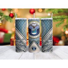 two tumblers with the seal of the united states on them, sitting in front of a christmas tree