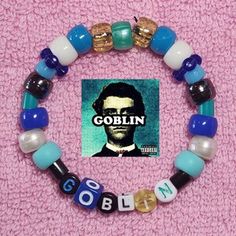 a beaded bracelet with an image of abraham lincoln on it and the words goblin spelled out