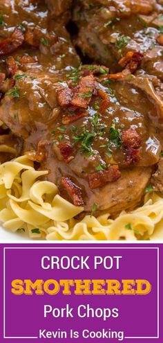 slow cooker smothered pork chops served over pasta on a white plate