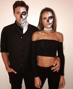 two people with makeup on their faces and one is wearing a skeleton face paint mask