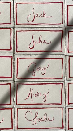 some red and white tiles with writing on them