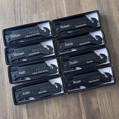 six pairs of knives in black boxes on a wooden floor with labels for different types of knives