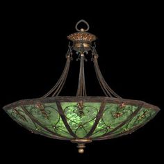 a chandelier with green glass in the shape of flowers and leaves on it