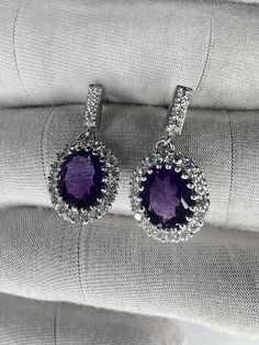 Amethyst Jewelry Aesthetic, Purple Oval Fine Jewelry Earrings, Elegant Purple Cubic Zirconia Crystal Earrings, Amethyst Drop Earrings For Anniversary, Gift Amethyst Jewelry With Halo Design, Elegant Purple Crystal Earrings, Purple Oval Earrings For Weddings, Formal Lavender Amethyst Earrings, Amethyst Jewelry With Sparkling Stones For Gifts