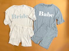 two t - shirts that say bride and babe on them, sitting next to each other