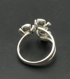 Sterling silver ring 925/1000, flower. Stamped 925.Approximate weight 4.9 grams. Top width 2.0 cm (0.80 inches). All our jewels are made from solid sterling silver 925/1000 and are carefully crafted by hand in our family workshop. We dispatch your orders in 5 working days, worldwide and the postage is $5. We ship registered priority mail. Please allow 5-7 working days for delivery in Europe and 10-15 working days outside Europe. For any questions - please do not hesitate to contact me! Silver Open Ring Flower Design For Anniversary, Formal Silver Open Ring With Flower Design, Formal Silver Flower Open Ring, Formal Flower Ring Stamped 925, Formal Flower Shaped Rings Stamped 925, Hallmarked Sterling Silver Flower Ring For Anniversary, Formal Flower Shaped 925 Silver Ring, Formal Sterling Silver Flower Ring, Sterling Silver Flower Ring For Formal Occasions