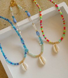 This how necklace comes in three styles and are 15 inches long. All jewelry comes with a Beaded by Sandy care card explaining the best ways to take care of your jewelry.  Designed and handmade just for you in the USA. About the brand: Based in South Texas, Beaded by Sandy crafts unique beaded jewelry, led by an aspired entrepreneur and student, embodying female empowerment and Latina ownership. Seashell Bead Necklace, Unique Beaded Jewelry, Small Bead Bracelet, Crafts Unique, South Texas, Female Empowerment, Care Card, Beaded Necklaces, Austin Tx