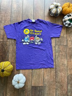 Vintage Halloween M&M's T-Shirt, Vintage Halloween Candy T-Shirt, M&M's Tee, So Sweet It's Scary T-Shirt, Vintage Halloween Shirt, 2000s Tee Size Medium 100% Cotton Made in Mexico of USA fabric M&M's Brand Measurements: Shoulder- 20 inches Sleeve- 8.5 inches Chest- 42 inches Length- 28 inches B9 Vintage Halloween Candy, Red Floral Skirt, Costume Ideas Halloween, Cowgirl Costume, Studded Denim, Halloween Horror Nights, Horror Nights, Halloween Sweater, Halloween Poster