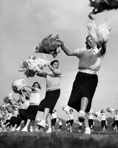 a group of young women are playing with some kind of thing in the air