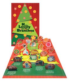 a christmas card with an image of a tree and other items on the front cover