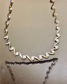 "DeKara Designs Classic Metal-14K Yellow Gold/White Gold, .583. Stones- 20 Round Diamonds G-H Color SI1-SI2 Clarity 0.90 Carats. Beautiful Modern Handmade 14K Two Tone Gold Diamond Necklace. The necklace features 44 round link made in 14K White Gold that are individually handmade and soldered in between two 14K Yellow Gold \"S\" links. There are 20 round dazzling diamonds that are professionally bezel set in 14K White Gold links. The necklace is entirely handmade with measurements of 15 inches. Elegant Gold Custom Necklace With Diamond Accents, Elegant Custom Necklace Stamped 14k For Formal Occasions, Gold Custom Necklace With 17 Jewels For Formal Occasions, Classic Gold Hand Set Necklace, Classic Gold Necklace With Hand Set, Classic Hand Set Gold Necklace, Elegant Round Custom Necklace Stamped 14k, Elegant Custom Round Necklace Stamped 14k, Elegant 14k Stamped Custom Necklace For Anniversary