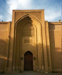 an ornate building with a wooden door