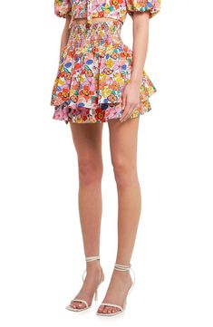 A print of vibrant blooms adds to the sweetness of a flouncy tiered miniskirt fashioned with a comfy smocked waist. Lined 100% cotton Hand wash, dry flat Imported Casual Tiered Bottoms With Floral Print, Playful Floral Print Bottoms For Spring, Playful Floral Print Spring Bottoms, Flirty Floral Print Bottoms For Spring, Flirty Floral Print Spring Bottoms, Spring Tiered Bottoms With Layered Hem, Floral Print Tiered Skirt For Garden Party, Playful Ruffled Bottoms For Spring, Playful Ruffled Skirt For Spring