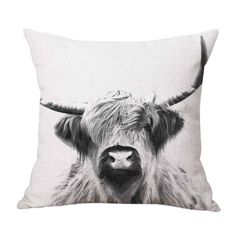 a black and white photo of a cow's head on a pillow cover,