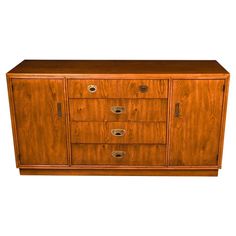 a wooden cabinet with three drawers on one side and two doors on the other end