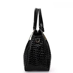 Step out in style with the Christine Genuine Leather Tote Bag! Its crocodile pattern, exquisite details, and elegant design make it a must-have piece that can match any outfit. With its large capacity and high-quality leather material, this tote bag is both practical and sophisticated. This bag will make you feel confident and classy wherever you go! Exclusively available in black. Luxury Crocodile Pattern Handheld Bag, Classic Crocodile Pattern Shoulder Bag For Daily Use, Luxury Handheld Shoulder Bag With Crocodile Pattern, Elegant Crocodile Pattern Shoulder Bag For Office, Elegant Office Shoulder Bag With Crocodile Pattern, Elegant Shoulder Bag With Top Handle And Crocodile Pattern, Office Crocodile Pattern Top Handle Satchel, Business Shoulder Bag With Crocodile Pattern And Top Handle, Office Top Handle Satchel With Crocodile Pattern