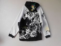 "Men's hoodie Black and white floral pattern Colorful floral patterns on hood Draw string Material - 60% cotton, 40% polyester Normal wear signs, but condition is great Dimension - shoulder 21\", armpit to armpit 26\" sleeve 23.5\" length 31\"" White Casual Hoodie With Floral Print, White Cotton Hoodie With Floral Print, White Floral Print Cotton Hoodie, Spring Streetwear Hooded Jacket, White Floral Print Hoodie For Spring, Floral Print Long Sleeve Outerwear For Streetwear, White Streetwear Hooded Jacket For Spring, White Hooded Jacket For Spring Streetwear, Winter Floral Print Cotton Hoodie