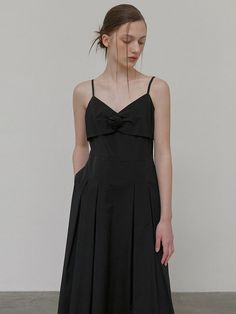 This product fuses elegance with simplicity, featuring a delicate corsage accent for a touch of romantic flair. The slender straps and sleek bodice cascade into a flowing skirt, creating a silhouette that's both timeless and modern. It's a versatile piece that can be dressed up for formal events or styled for a chic, casual look. - The dress boasts a flattering slip design, accentuated by a tasteful corsage detail for an added element of sophistication.- Its fluid skirt and fitted waist highlight the body's contours while providing comfort and ease of movement.- The fine straps and squared neckline present a display of minimalistic charm, suitable for various occasions.- Crafted with a blend of grace and practicality, this dress stands out with its understated beauty and functional el Elegant Suspender Dress With Fitted Bodice For Evening, Elegant Evening Suspender Dress With Fitted Bodice, Elegant Suspender Dress With Adjustable Straps And Fitted Bodice, Elegant Formal Dresses With Delicate Straps, Elegant Suspender Dress With Sweetheart Neckline, Elegant Evening Suspender Dress With Delicate Straps, Elegant Evening Suspender Dress For Spring, Formal Suspender Dress With Adjustable Spaghetti Straps, Elegant Suspender Dress With Adjustable Straps For Formal Occasions