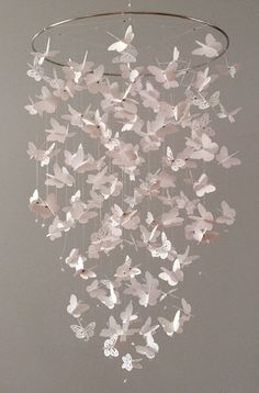 a mobile with butterflies hanging from it