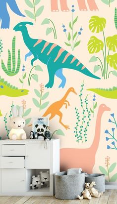 the dinosaur wallpaper in this children's room is very colorful and has an interesting pattern