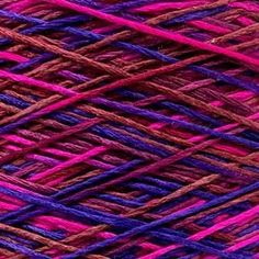 purple and red yarn is shown in this image