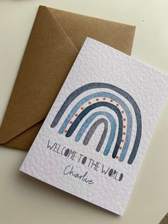 a card with the words welcome to the wild on it and a rainbow in the background