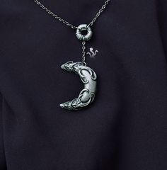 Fantasy gothic moon crescent necklace by Mythic Hydra ⚶ moon necklace, crescent jewelry, grunge, goth, gothic, LARP jewelry, fantasy, magical, witch, witchy, dark fantasy, alternative #grunge #witch #witchy #dark Black Crescent Metal Necklace, Black Metal Crescent Necklace, Gothic Silver Crescent Necklace, Gothic Crescent Silver Necklace, Gothic Moon Charm Pendant Necklace, Gothic Moon Charm Pendant Necklaces, Gothic Pendant Necklaces With Moon Charm, Gothic Necklaces With Moon Charm Pendant, Gothic Moon Charm Round Pendant Necklace