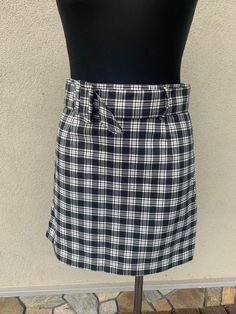 Vintage plaid skirt. The pleated mini skirt was made in the early 90's Black and white tartan skirt polyester fabric Excellent vintage condition SIZES: Eur 36 /US 6  Length: 17,5  inches (34 cm) Waist from seam to seam: 15 inches (37 cm) These pieces are in perfect, as good as a new vintage condition. Is it my size... ? The best way to check if a dress, tunic, or shirt will be a perfect fit for you is: 1. Take the same type of clothing from your wardrobe that is good for you. 2. Measure it on a flat table same as we do 3. Length 4. Width from armpit to armpit 5. Sleeve length etc. 6. Next compare those measurements that you made with measurements in the item description. Thanks to that kind of check you will be 100% sure that the clothing you purchase would be a perfect fit for you Brand: Plaid Tennis Skirt For School Summer Season, Plaid Pleated Skort For Summer, Preppy Plaid Mini Length Bottoms, Preppy Plaid Tennis Skirt For Summer, Plaid Skort For School, Plaid Mini Tennis Skirt For Summer, Preppy Plaid Mini Skirt For Summer, Plaid Pleated Skort For School Uniform, Preppy Plaid Mini Skirt For School