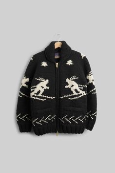 This authentic Cowichan sweater was knit by indigenous makers in Vancouver Island and the mainland of British Columbia. Each sweater is inspired from the original 19th century designs hand-knit by the Cowichan, a Coast Salish people in British Columbia. Authentic Cowichan sweaters are so distinctive and prized that in 2011, the Canadian government recognized Cowichan knitters and sweaters as nationally and historically significant. Our exclusive design incorporates miniature skiers into a black & white, handmade heirloom piece that you will wear and enjoy for years to come. This is a heavy sweater that you can wear as a piece of outerwear. Two angled pocketsHeavy-duty brass zipperSet-in Sleeves100% WoolHand-knit in British Columbia Size: S-XL (unisex) Sizing Chart Size XS Size Small Size M Cowichan Sweaters, Canadian Government, Coast Salish, Cowichan Sweater, Heavy Sweaters, Ski Sweater, Vancouver Island, Sizing Chart, British Columbia